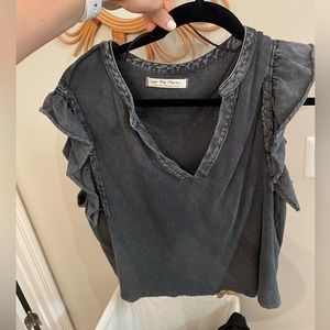 Free people black tee with ruffle short sleeves